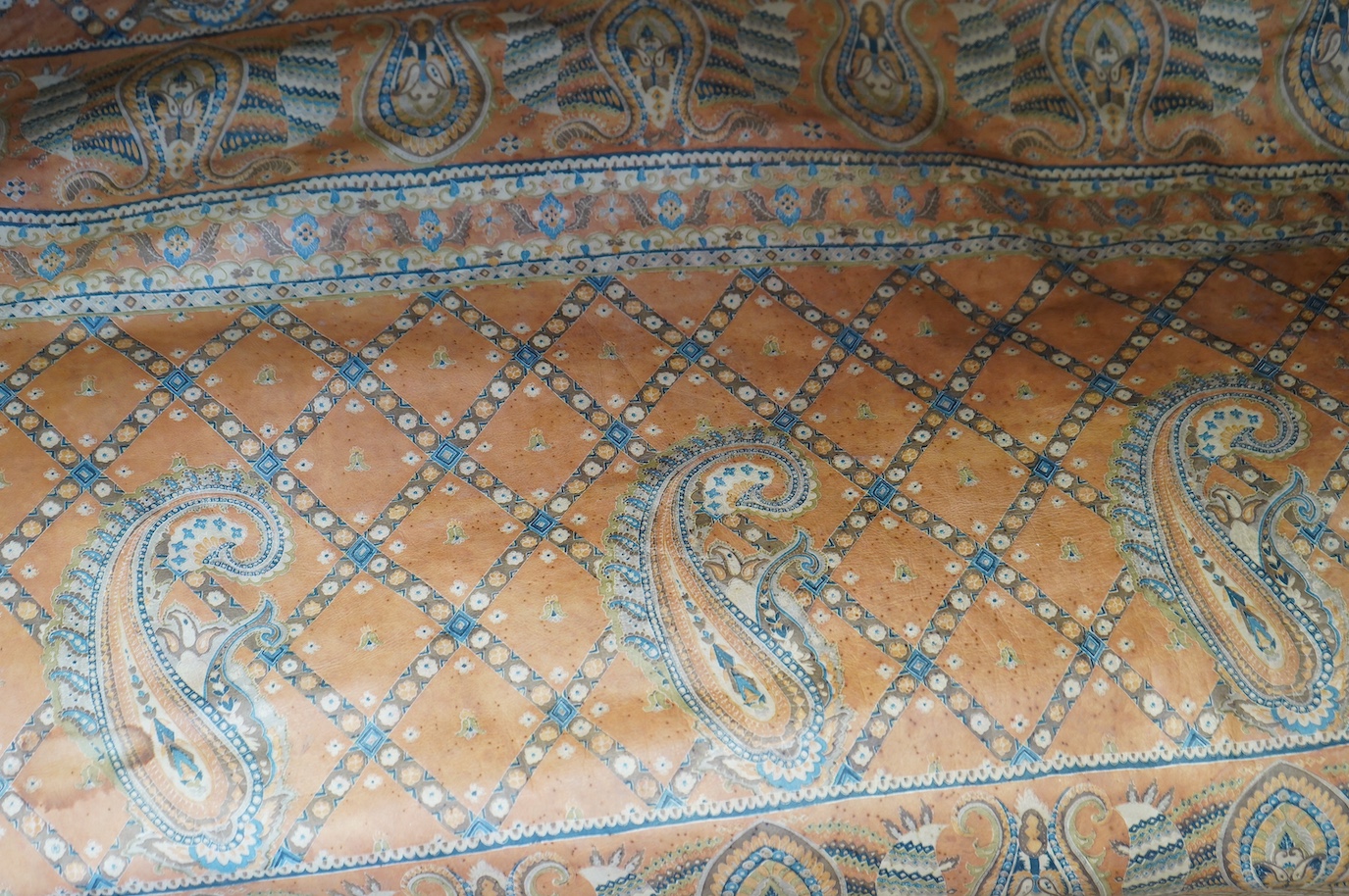 Two leather hides with printed boteh pattern decoration. Condition - fair